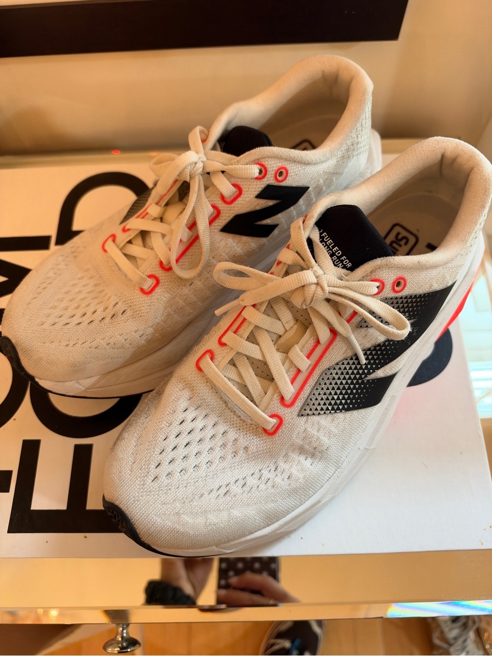 New Balance women’s White Running Sneakers with Black Logo and Coral Accents
